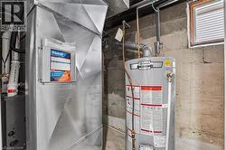Galvanized ductwork with a water heater and concrete block walls -