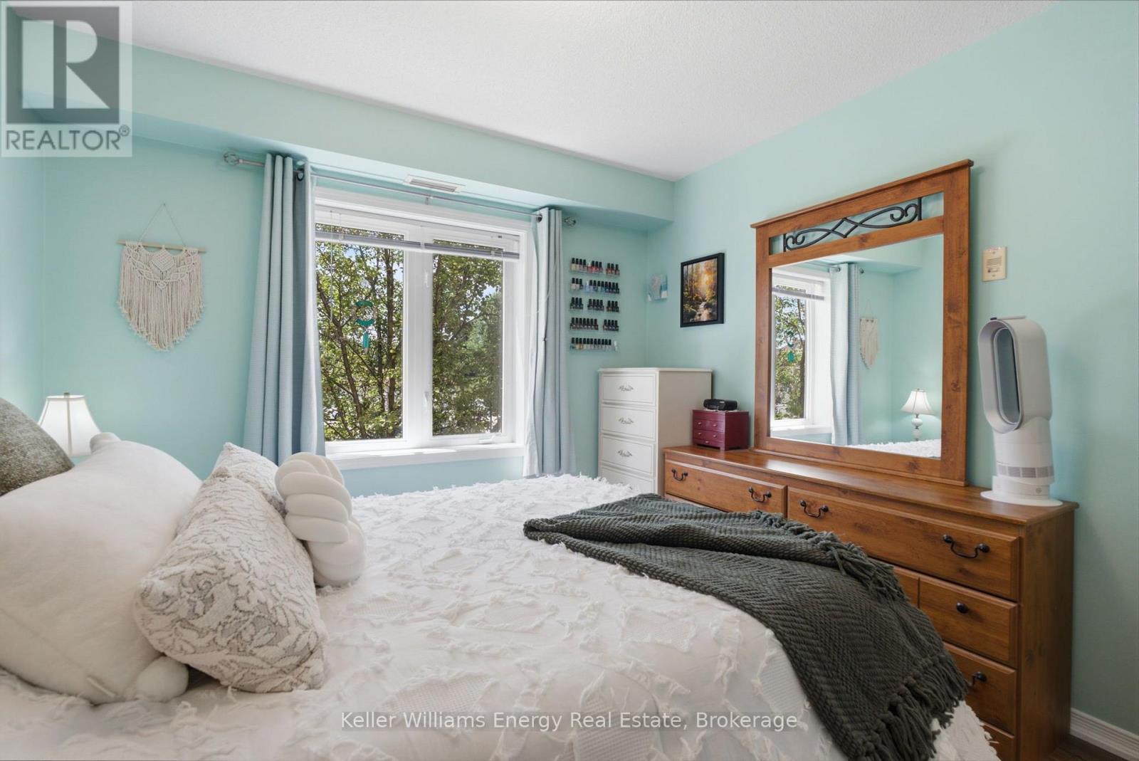 Natural privacy from shade tree outside - 204 - 124 Aspen Springs Drive, Clarington (Bowmanville), ON - Indoor Photo Showing Bedroom