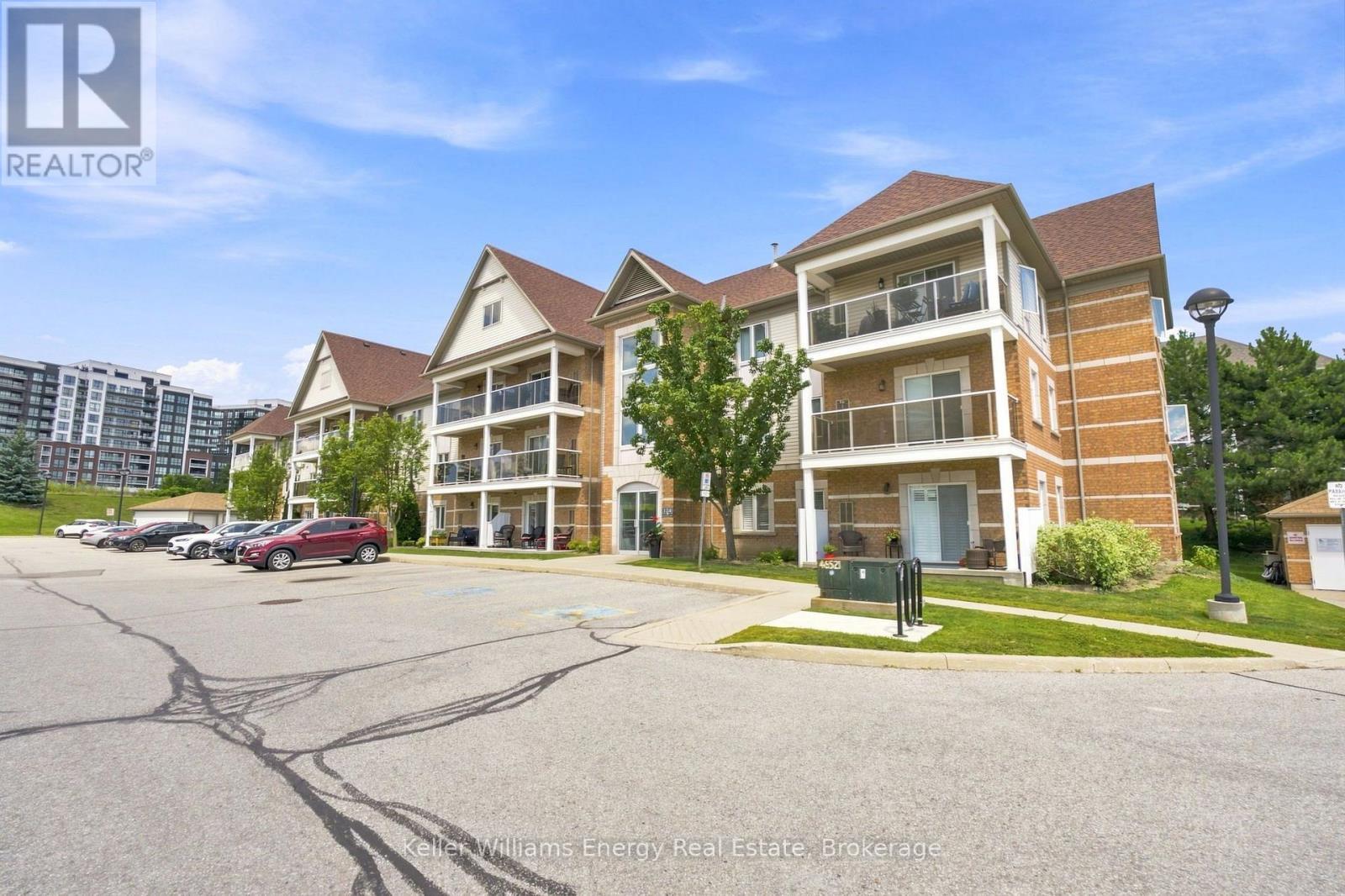 204 - 124 Aspen Springs Drive, Clarington (Bowmanville), ON - Outdoor With Balcony With Facade