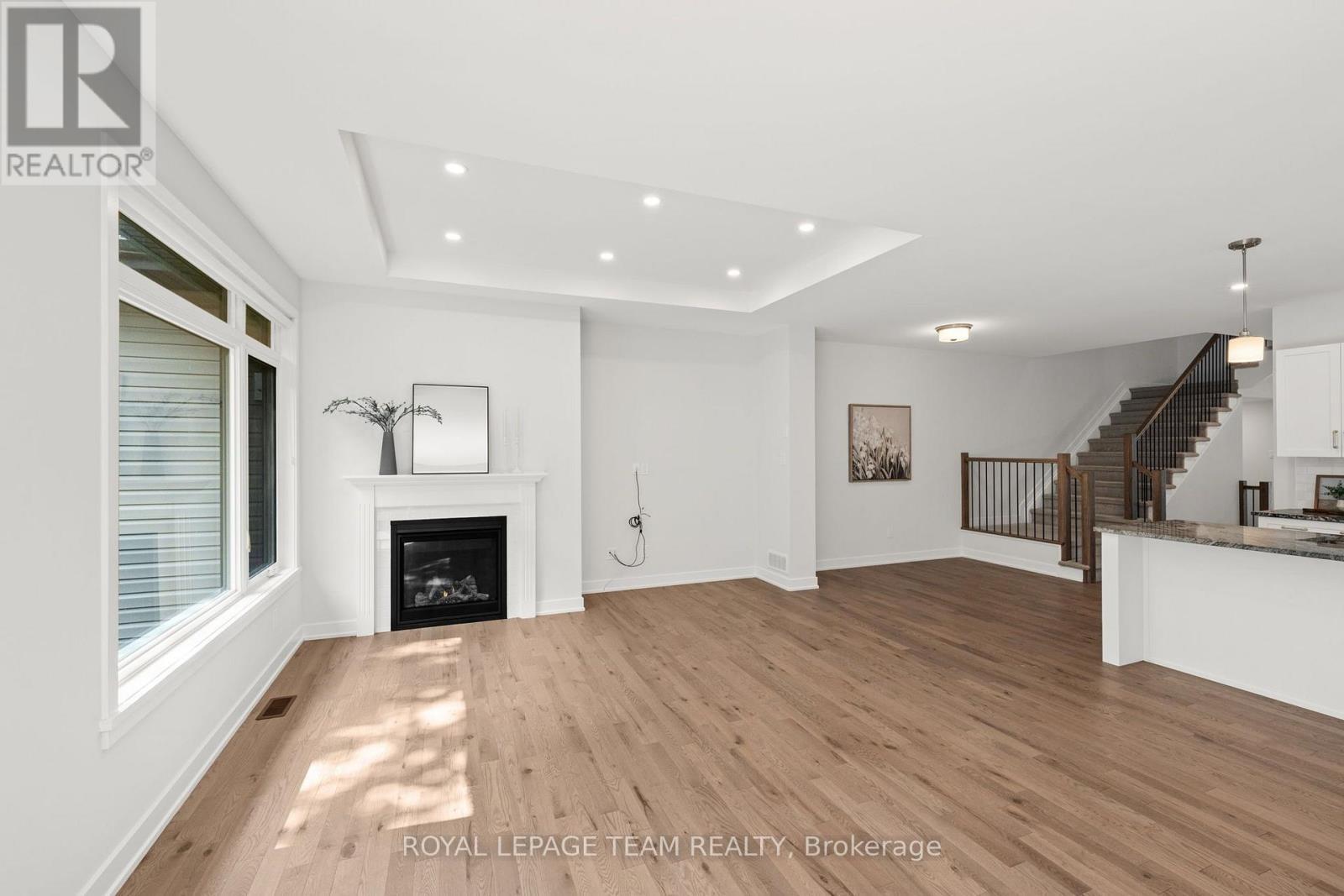 53 Mac Beattie Drive, Arnprior, ON - Indoor Photo Showing Other Room With Fireplace