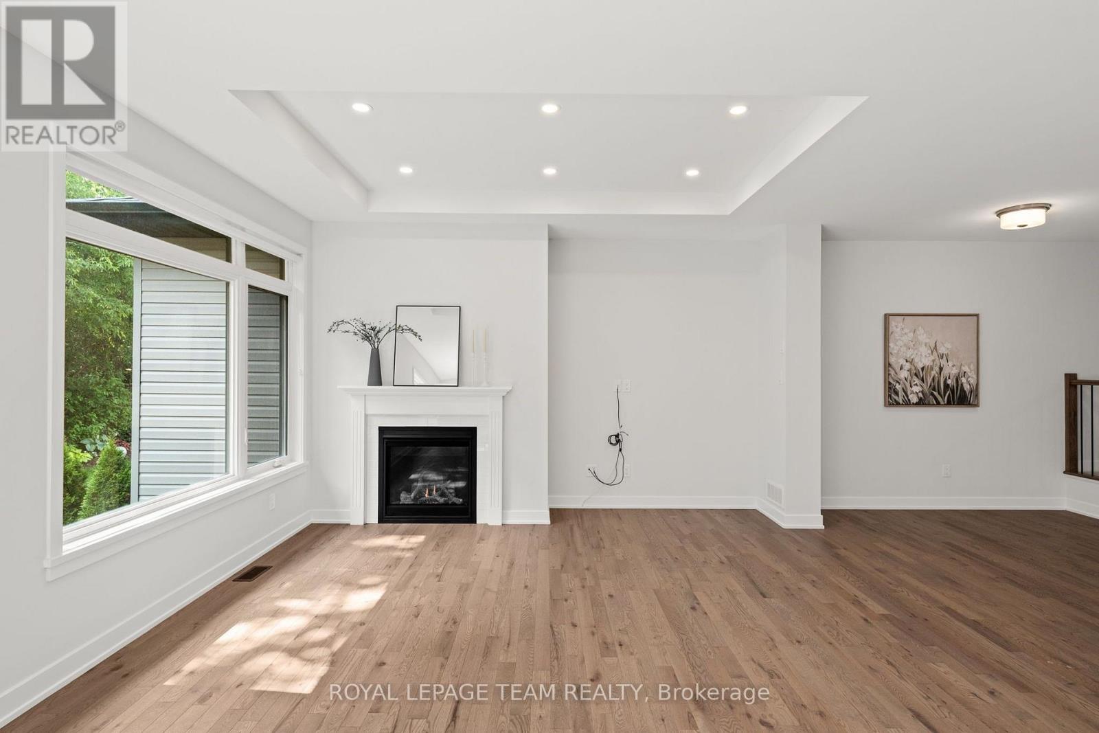 53 Mac Beattie Drive, Arnprior, ON - Indoor Photo Showing Living Room With Fireplace