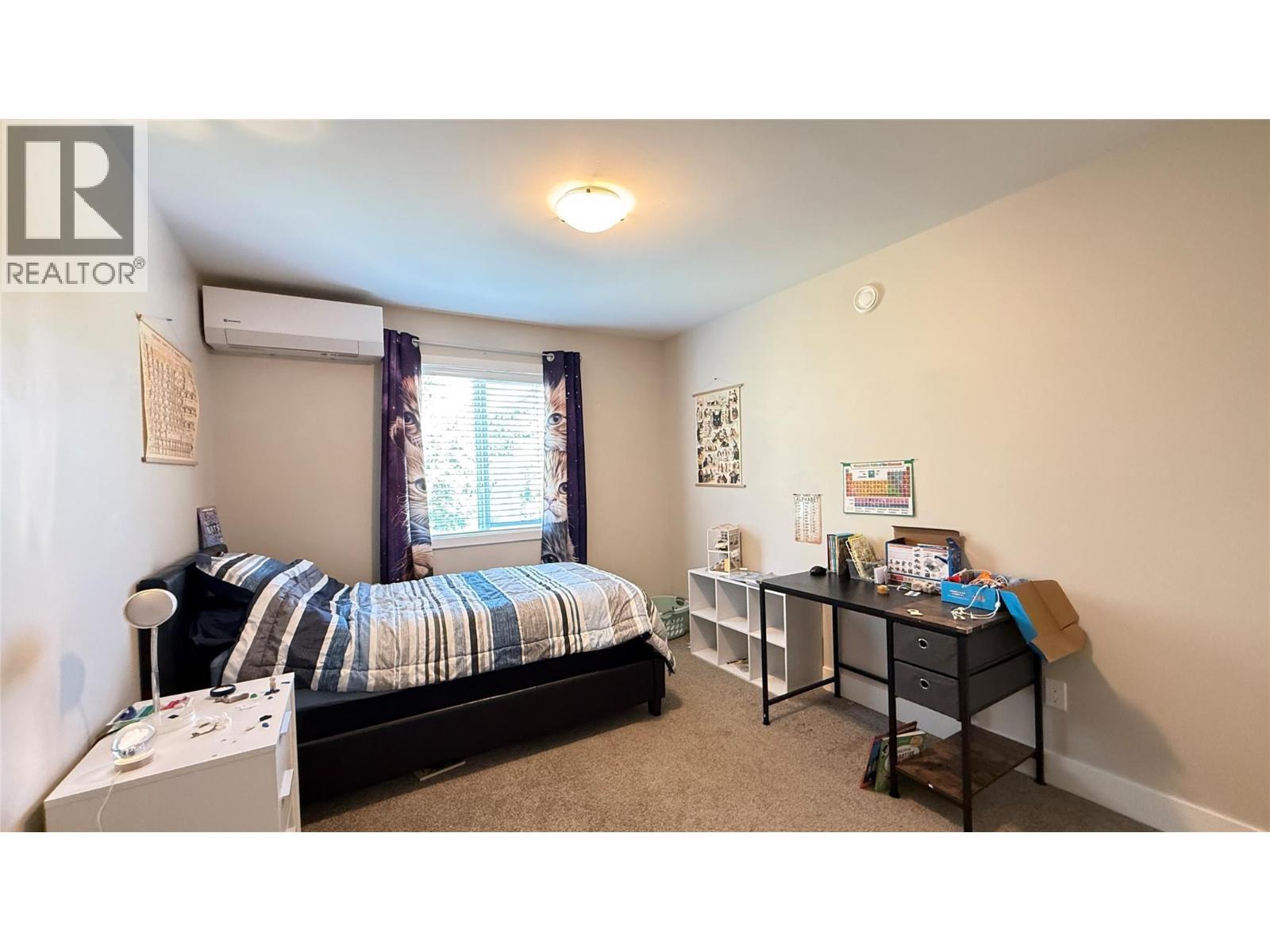 2410 Perrier Lane Unit# A, Nelson, BC - Indoor Photo Showing Bedroom