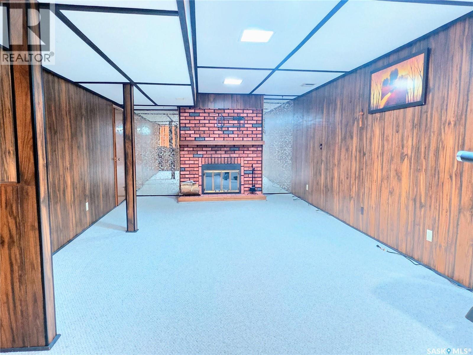 508 Mayer Street, Bruno, SK - Indoor Photo Showing Other Room With Fireplace