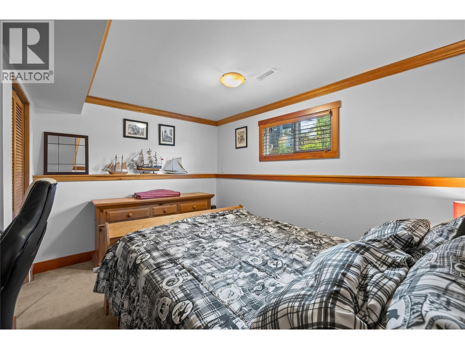 Third Bedroom (Lower Level) - 5054 Chute Lake Crescent, Kelowna, BC - Indoor Photo Showing Bedroom
