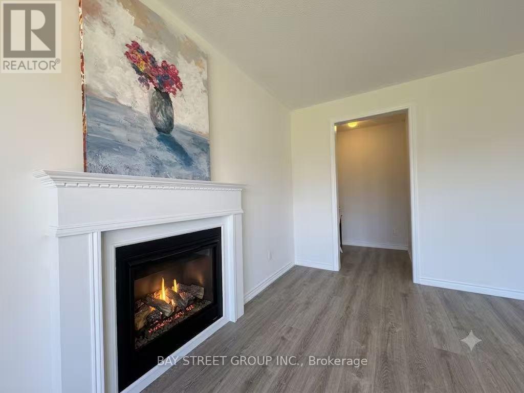 27 Samuel Crescent, Springwater, ON - Indoor Photo Showing Living Room With Fireplace