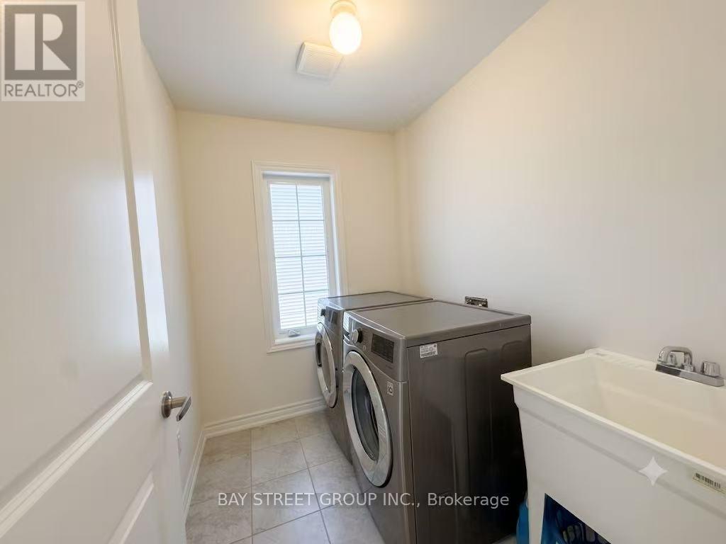 27 Samuel Crescent, Springwater, ON - Indoor Photo Showing Laundry Room