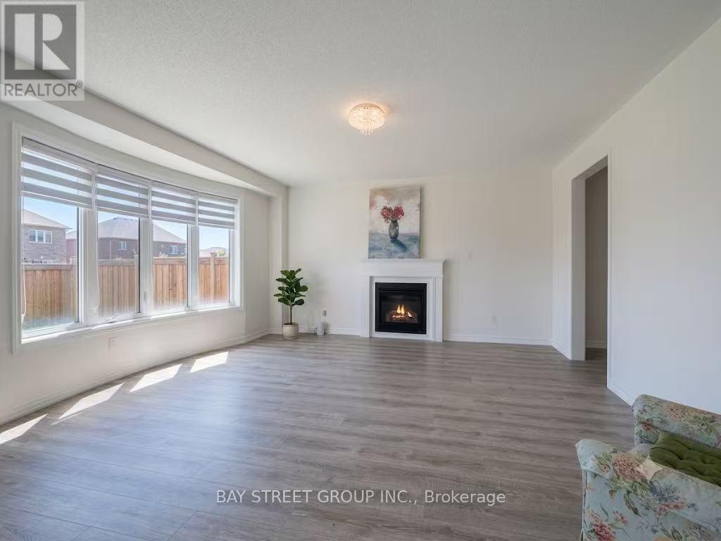27 Samuel Crescent, Springwater, ON - Indoor Photo Showing Living Room With Fireplace