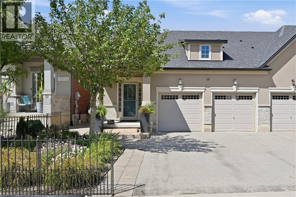 Exterior showcasing a stone facade, stucco siding, and a prominent dormer window - 10 Kopperfield Lane, Hamilton, ON - Outdoor