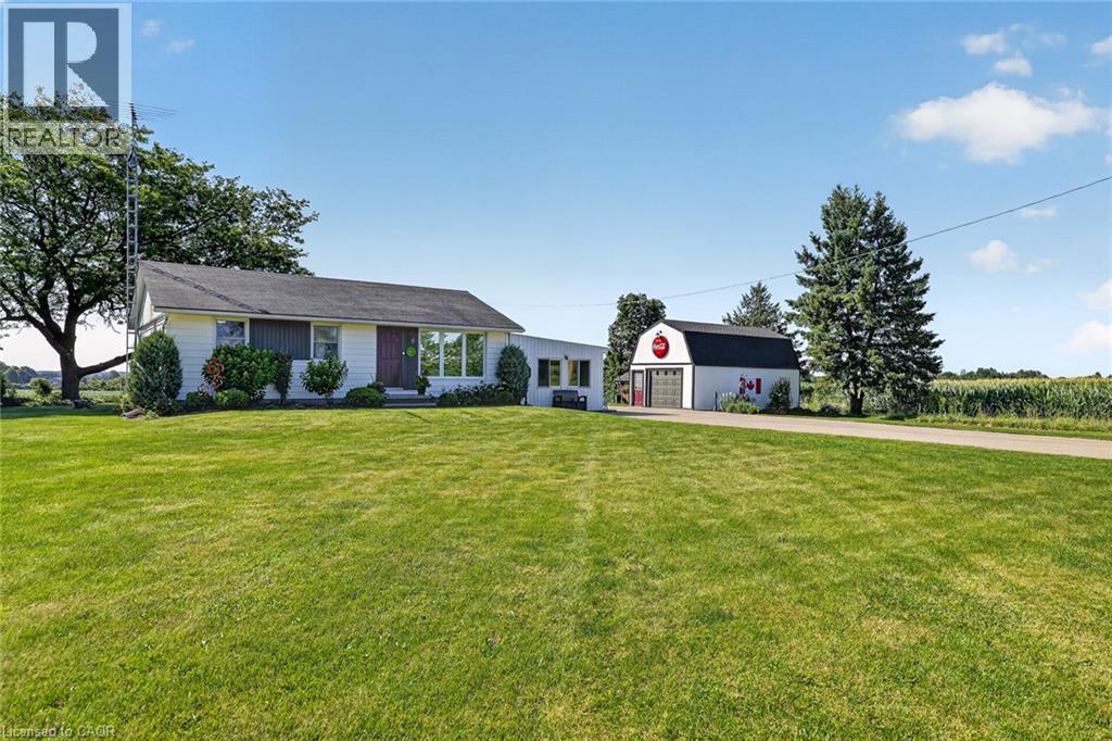 Ranch-style residence featuring a white exterior and a dark shingled roof - 184726 Cornell Road, Tillsonburg, ON - Outdoor