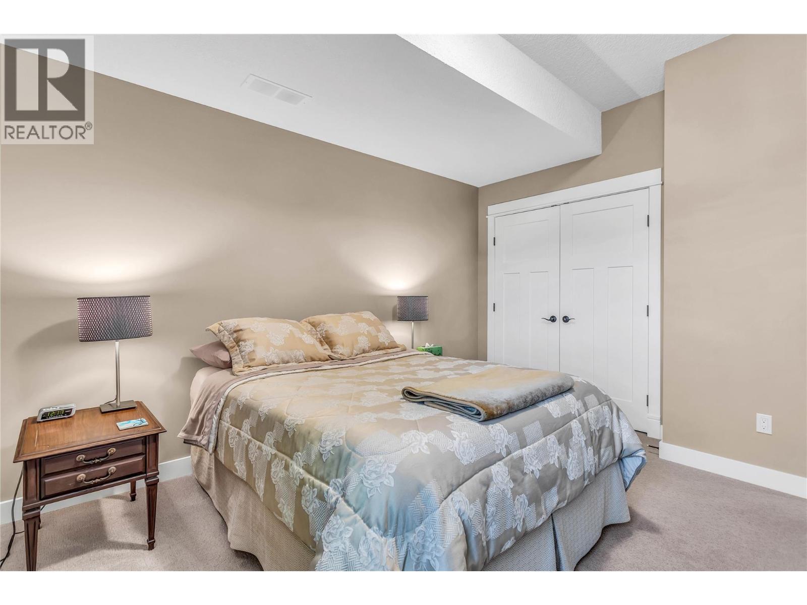 2nd Bedroom on Entry Level - 8780 Braeburn Drive, Coldstream, BC - Indoor Photo Showing Bedroom