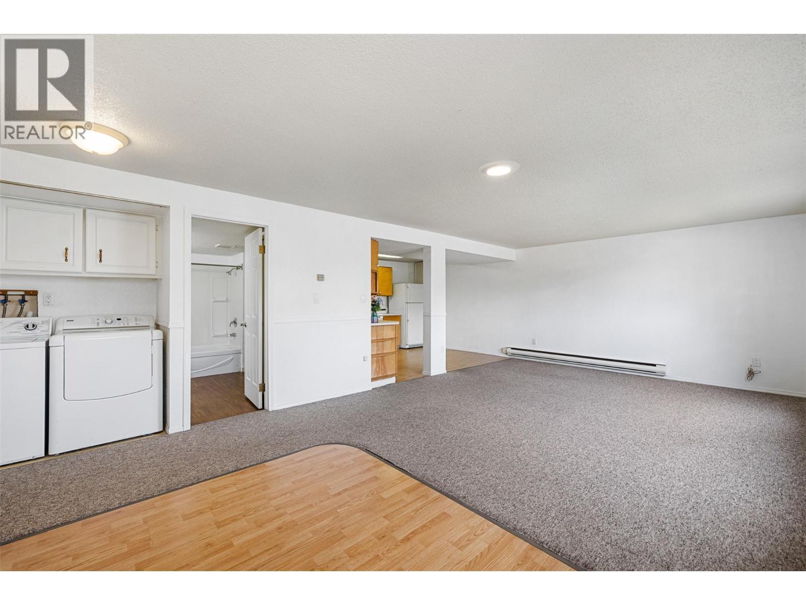 Dpwnstairs living & Kitchen - 3805 22 Avenue, Vernon, BC - Indoor Photo Showing Laundry Room
