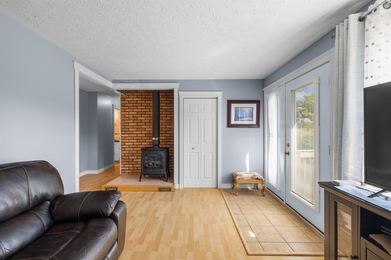 59 Vail Court, Stanhope, PE - Indoor Photo Showing Living Room With Fireplace