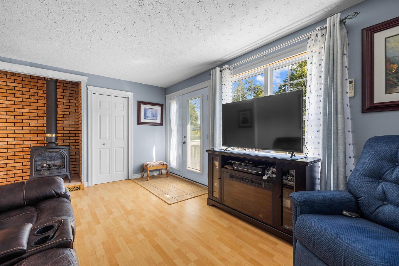 59 Vail Court, Stanhope, PE - Indoor Photo Showing Living Room With Fireplace