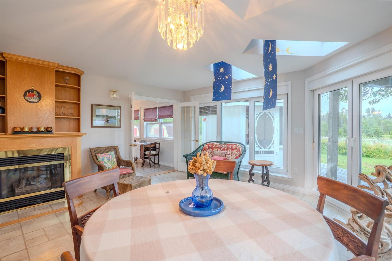 78 Lady Slipper Lane, Murray River, PE - Indoor Photo Showing Dining Room With Fireplace