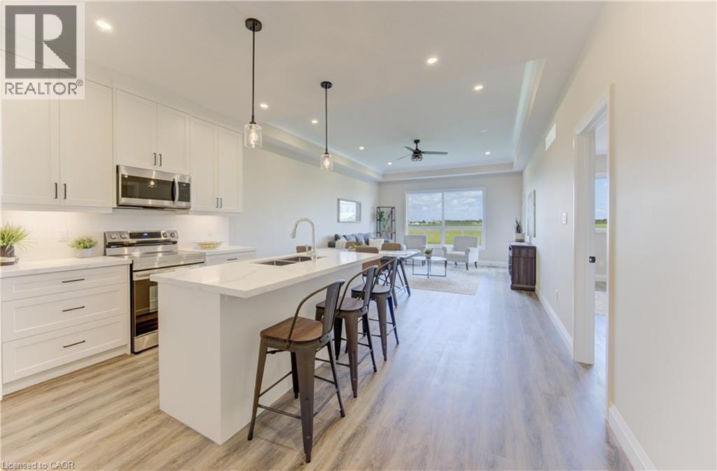 98 Bedell Drive, Drayton, ON - Indoor Photo Showing Kitchen With Double Sink With Upgraded Kitchen