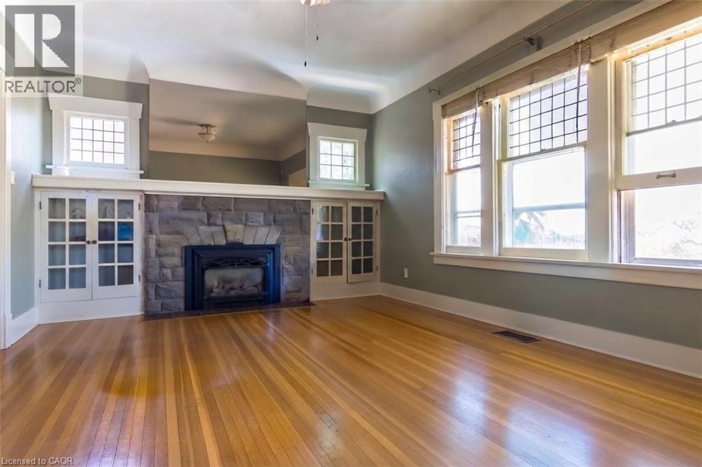 Living Room Virtually Decluttered - 121 Eastbourne Avenue, Hamilton, ON - Indoor Photo Showing Living Room With Fireplace
