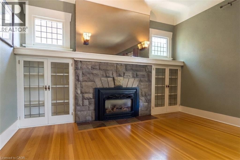 Living Room Virtually Decluttered - 121 Eastbourne Avenue, Hamilton, ON - Indoor Photo Showing Living Room With Fireplace