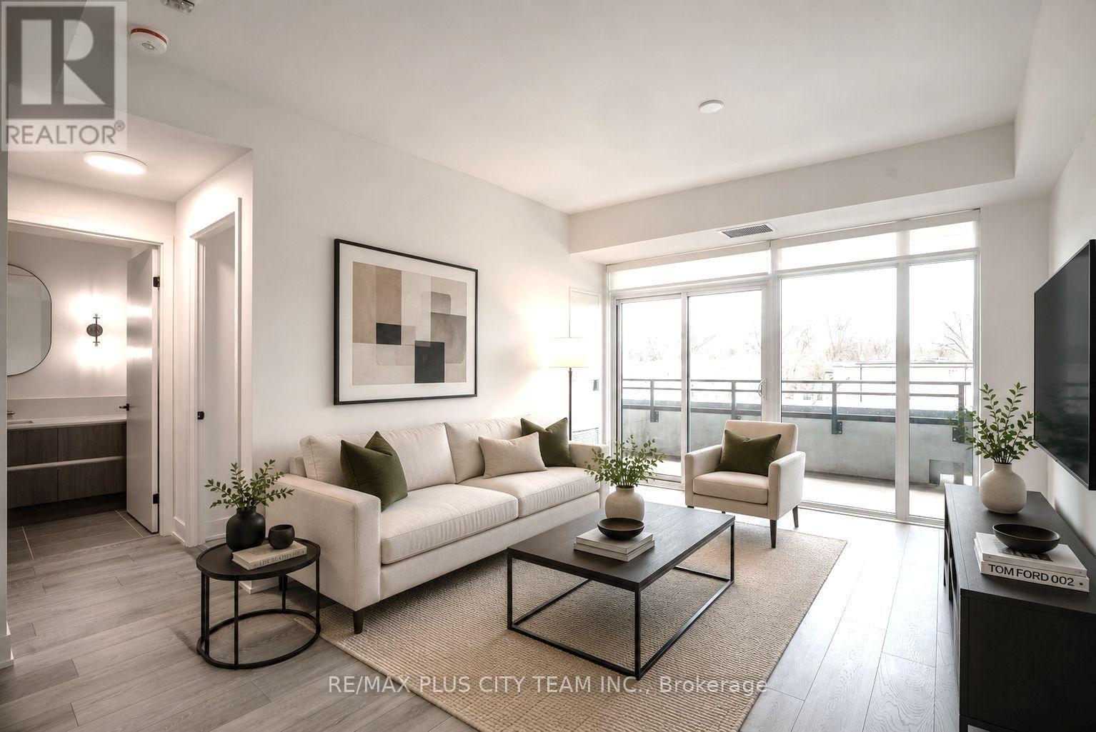 303 - 1285 Queen Street E, Toronto, ON - Indoor Photo Showing Living Room