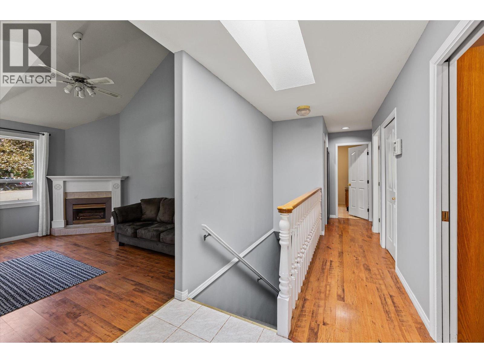 1881 Portland Place, Kelowna, BC - Indoor Photo Showing Other Room With Fireplace