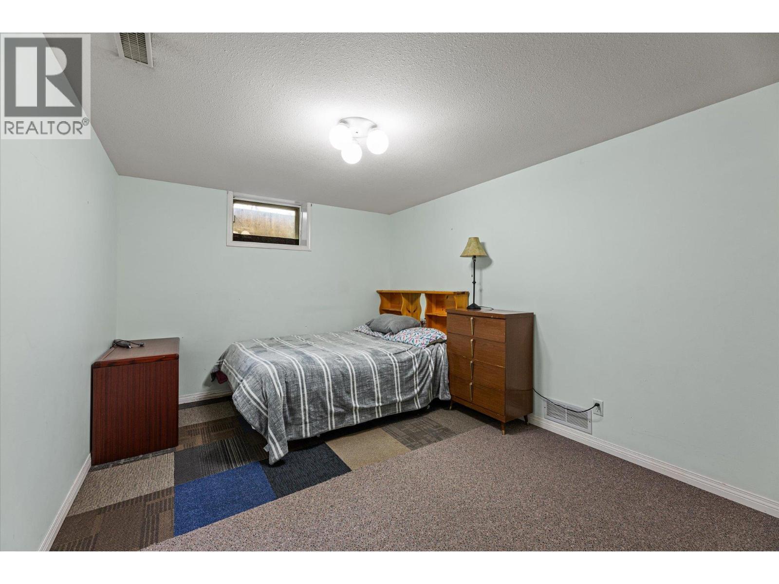 Basement level bedroom - 1881 Portland Place, Kelowna, BC - Indoor Photo Showing Bedroom