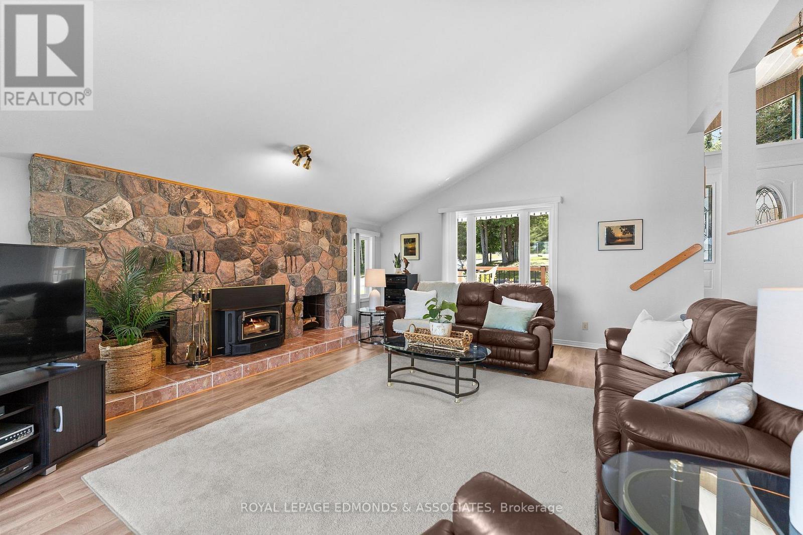 382 Greenway Drive, Whitewater Region, ON - Indoor Photo Showing Living Room With Fireplace