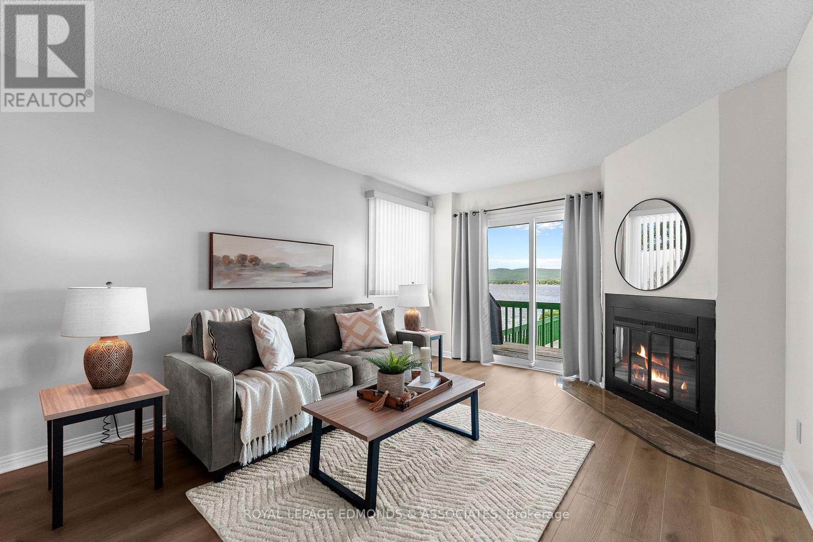 382 Greenway Drive, Whitewater Region, ON - Indoor Photo Showing Living Room With Fireplace