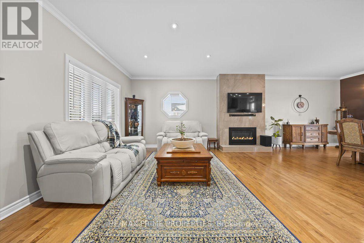 3421 Summerbreeze Drive, Ottawa, ON - Indoor Photo Showing Living Room With Fireplace