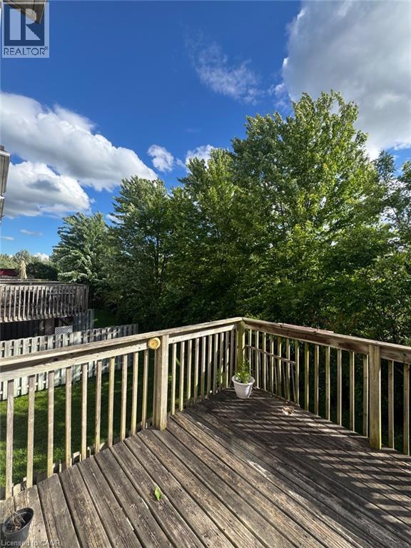 Expansive wood deck with full baluster railing and privacy fencing - 151 Clairfields Drive E Unit# 39, Guelph, ON - Outdoor