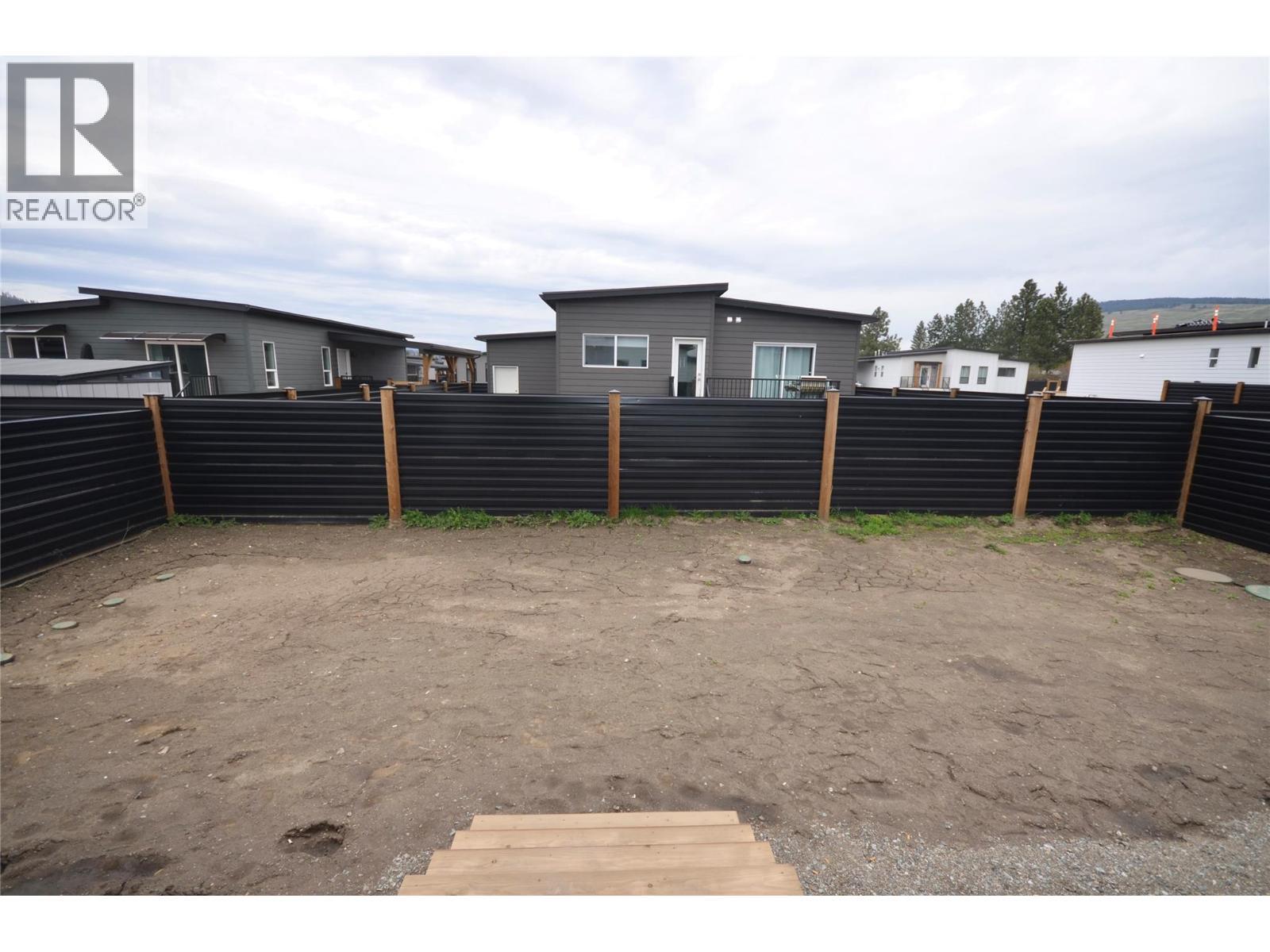 Fenced rear yard - 8900 Jim Bailey Road Unit# 126, Kelowna, BC