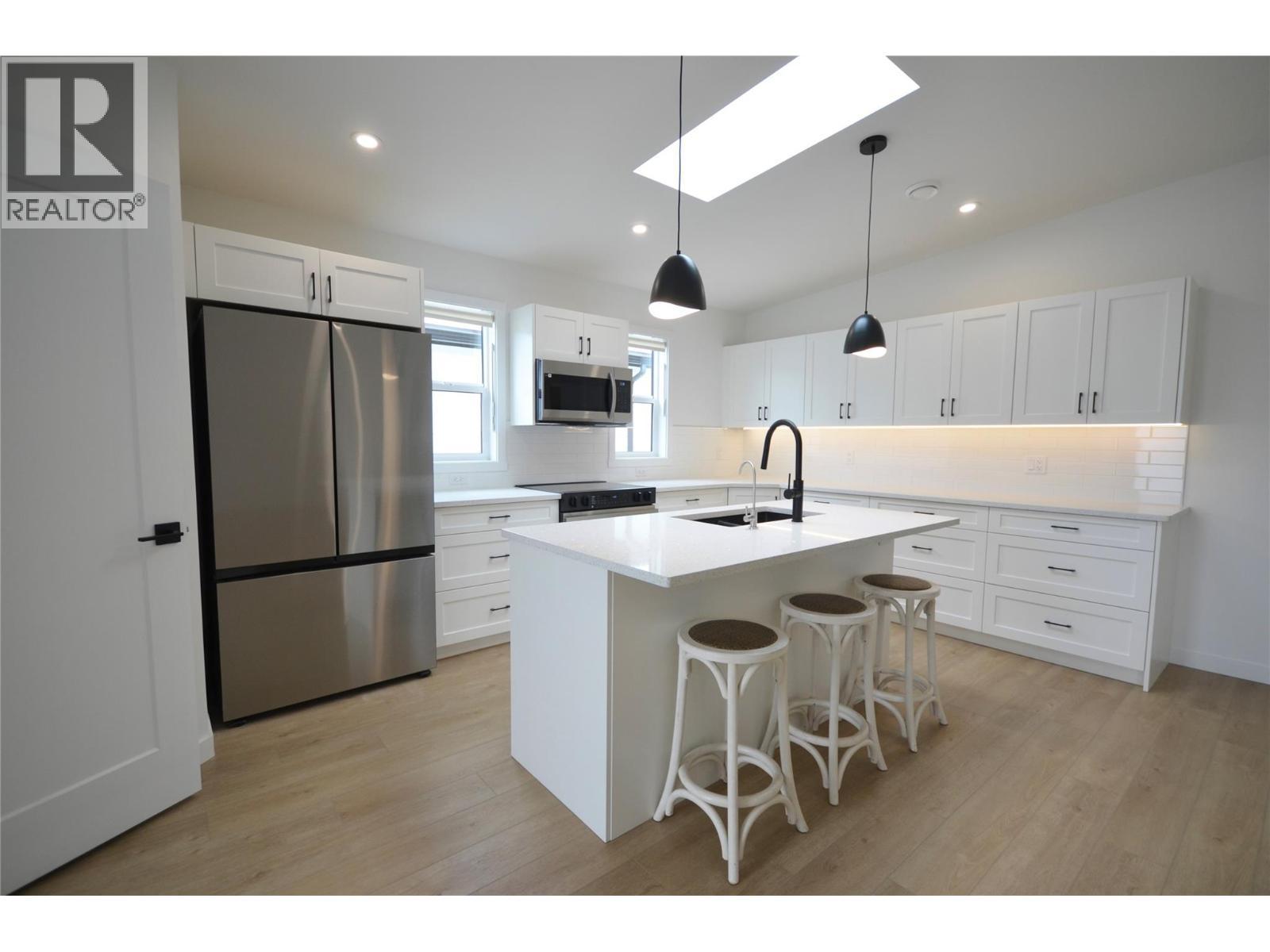Expanded and upgraded kitchen with skylight - 8900 Jim Bailey Road Unit# 126, Kelowna, BC