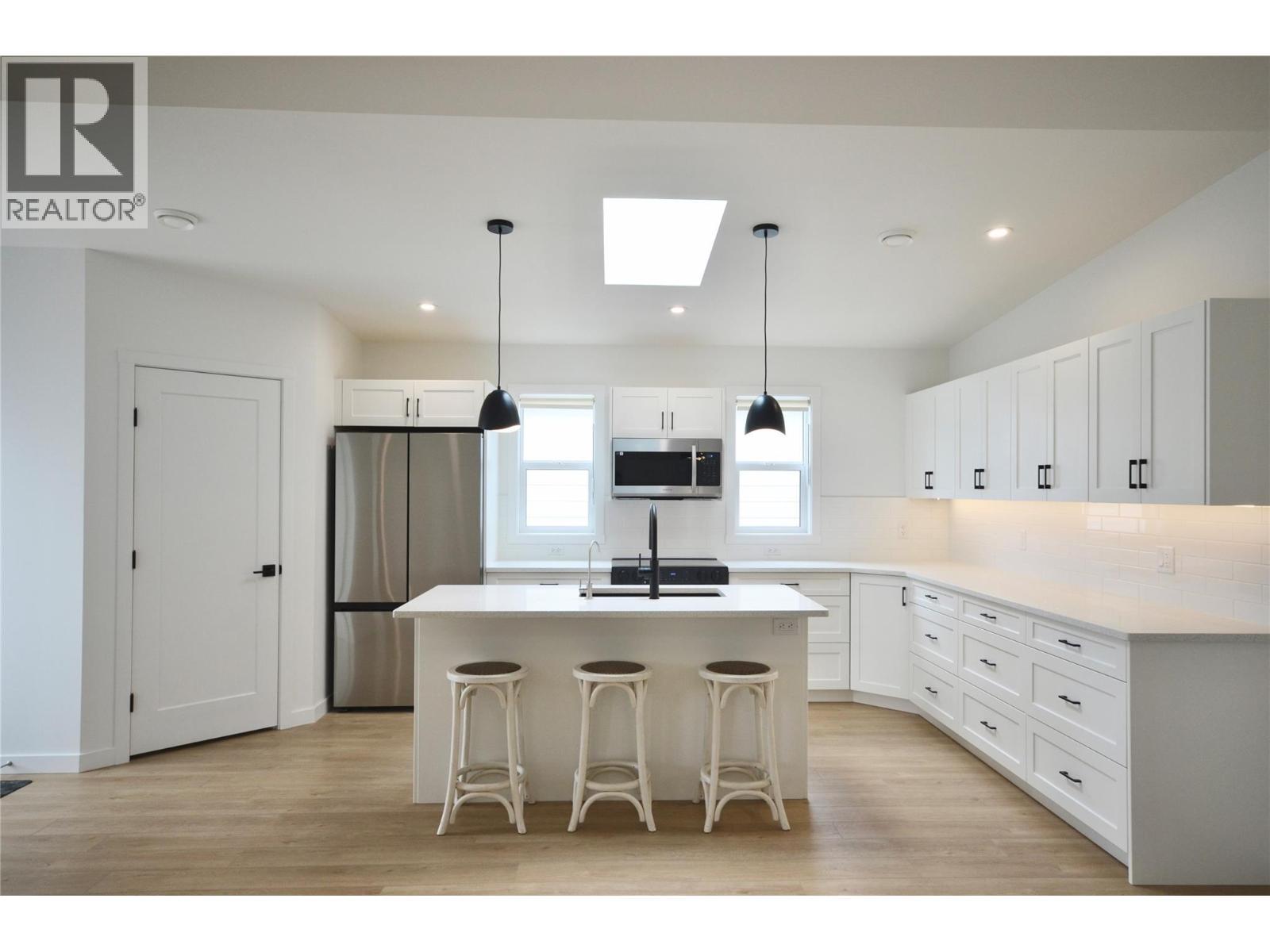 Expanded and upgraded kitchen with skylight - 8900 Jim Bailey Road Unit# 126, Kelowna, BC