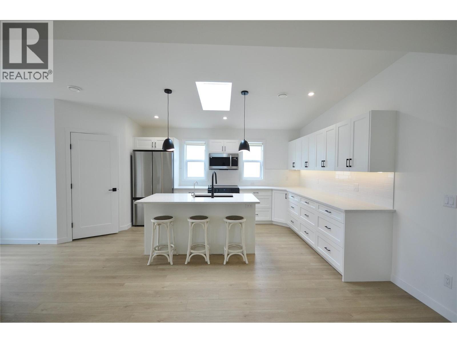 Expanded and upgraded kitchen with skylight - 8900 Jim Bailey Road Unit# 126, Kelowna, BC