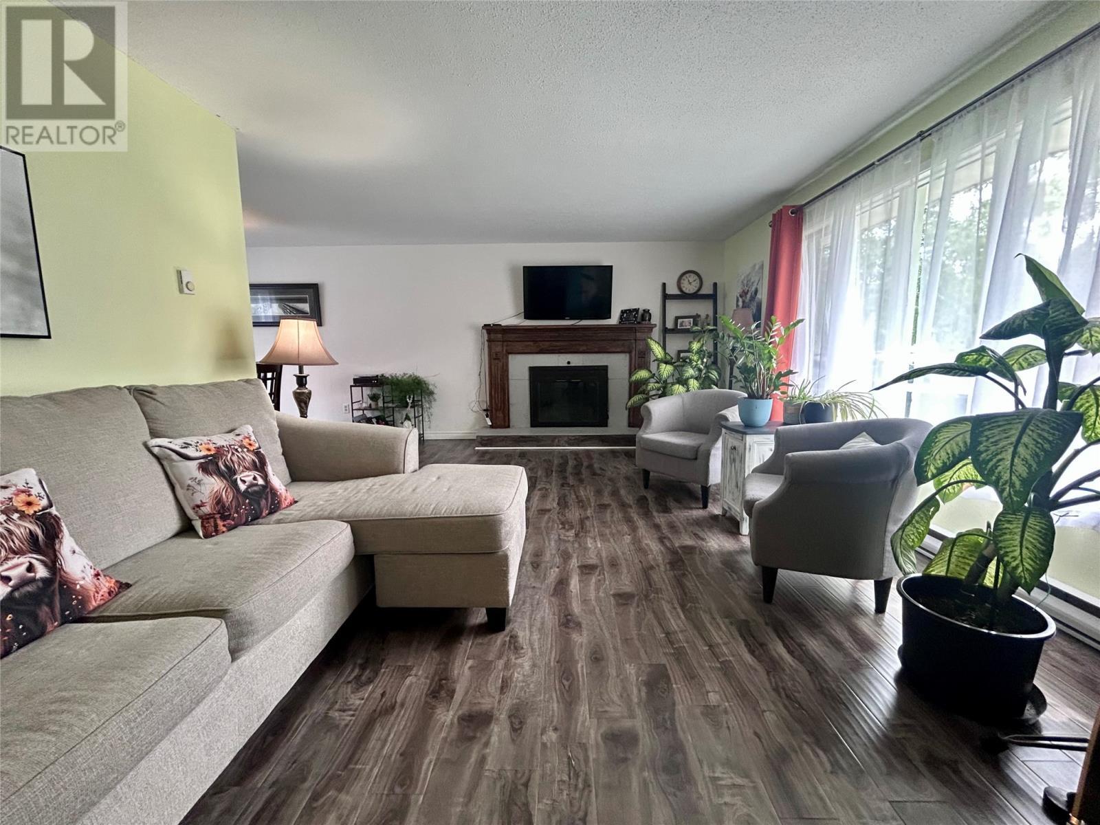 4 Elmwood Crescent, Pasadena, NL - Indoor Photo Showing Living Room With Fireplace