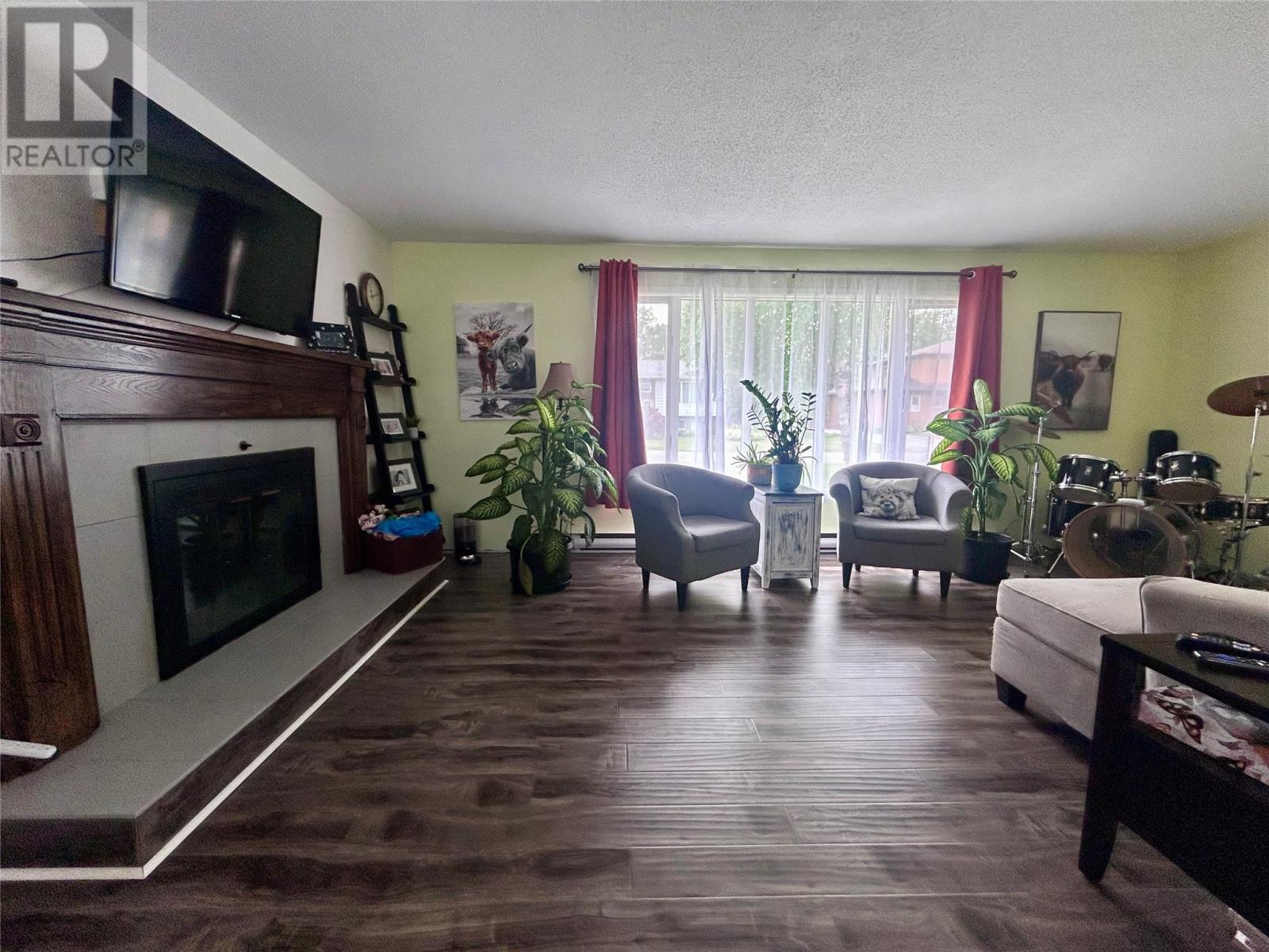 4 Elmwood Crescent, Pasadena, NL - Indoor Photo Showing Living Room With Fireplace