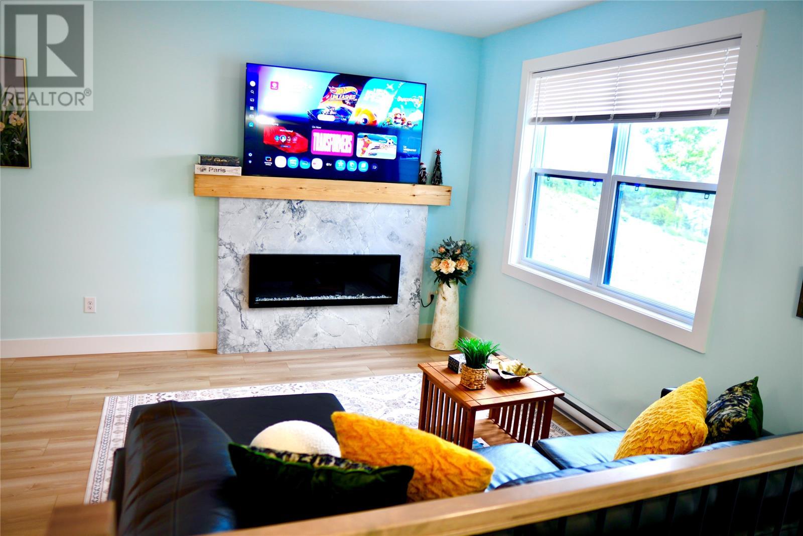 70 Island Cove Road, Bay Bulls, NL - Indoor Photo Showing Living Room With Fireplace