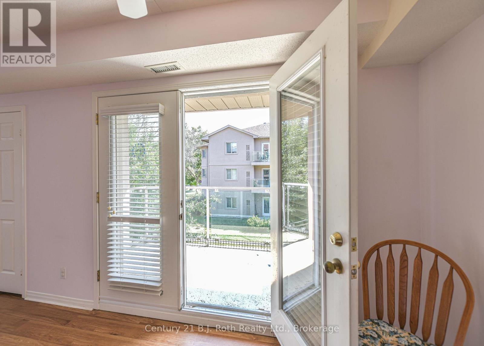 Garden doors to balcony - Unit 201 - 115 Bond Street, Orillia, ON - Indoor Photo Showing Other Room