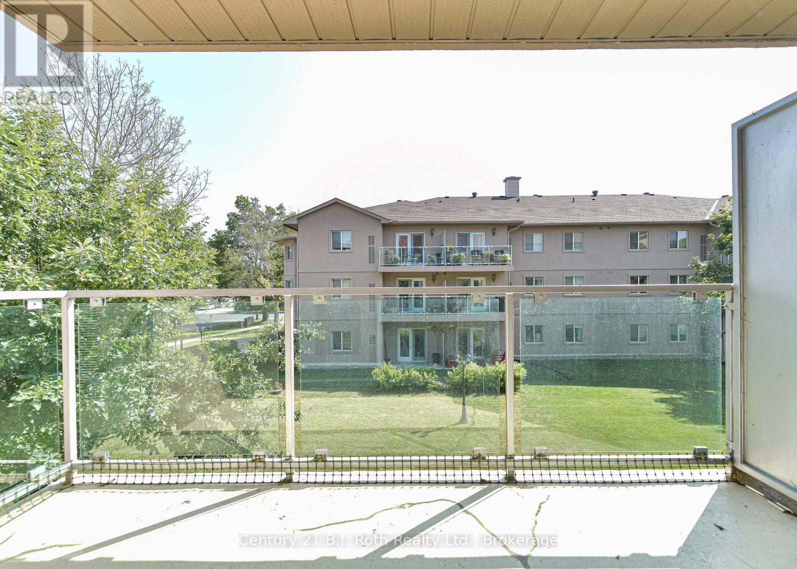 Garden views - Unit 201 - 115 Bond Street, Orillia, ON - Outdoor With Balcony