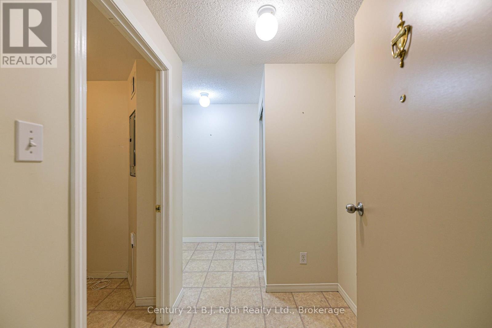 Close to elevator and stairs - Unit 201 - 115 Bond Street, Orillia, ON - Indoor Photo Showing Other Room