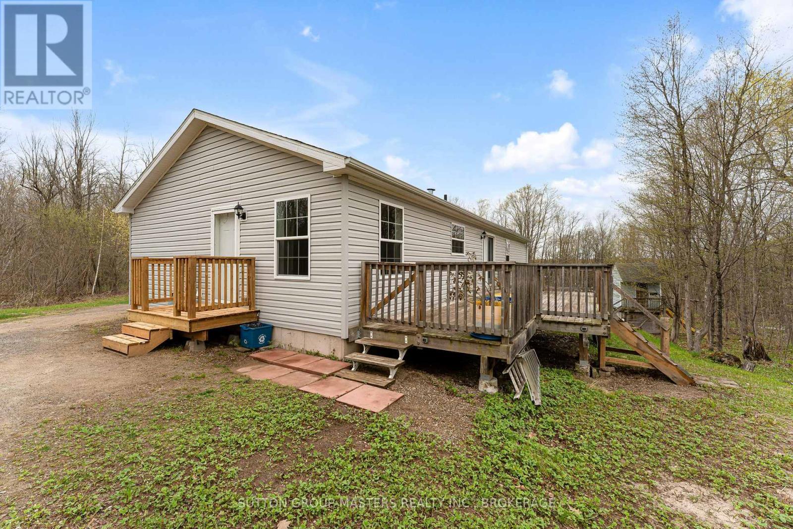 1140 St. Georges Lake Road, Frontenac (Frontenac Centre), ON - Outdoor With Deck Patio Veranda