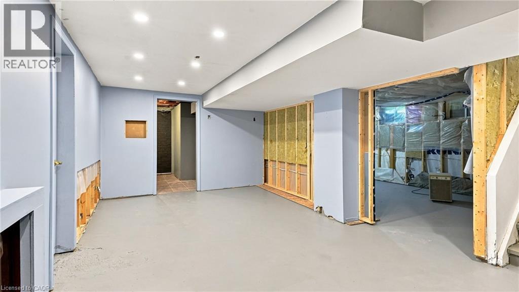 Lower level with recessed lighting, exposed wall framing, and a partially finished floor - 524 Dorval Drive, Ancaster, ON - Indoor