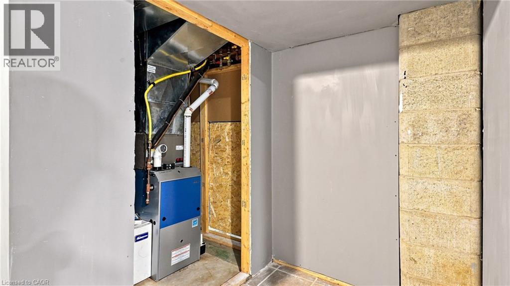 Dedicated utility area featuring a modern furnace unit with associated ductwork and piping - 524 Dorval Drive, Ancaster, ON - Indoor Photo Showing Other Room