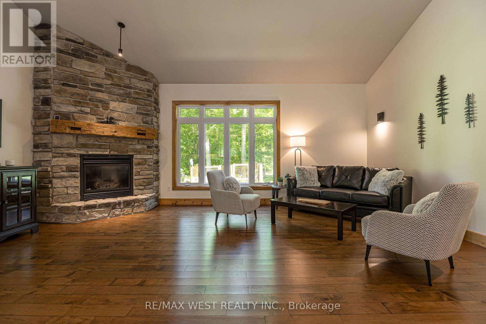 215 Flatrock Road, Tweed, ON - Indoor Photo Showing Living Room With Fireplace