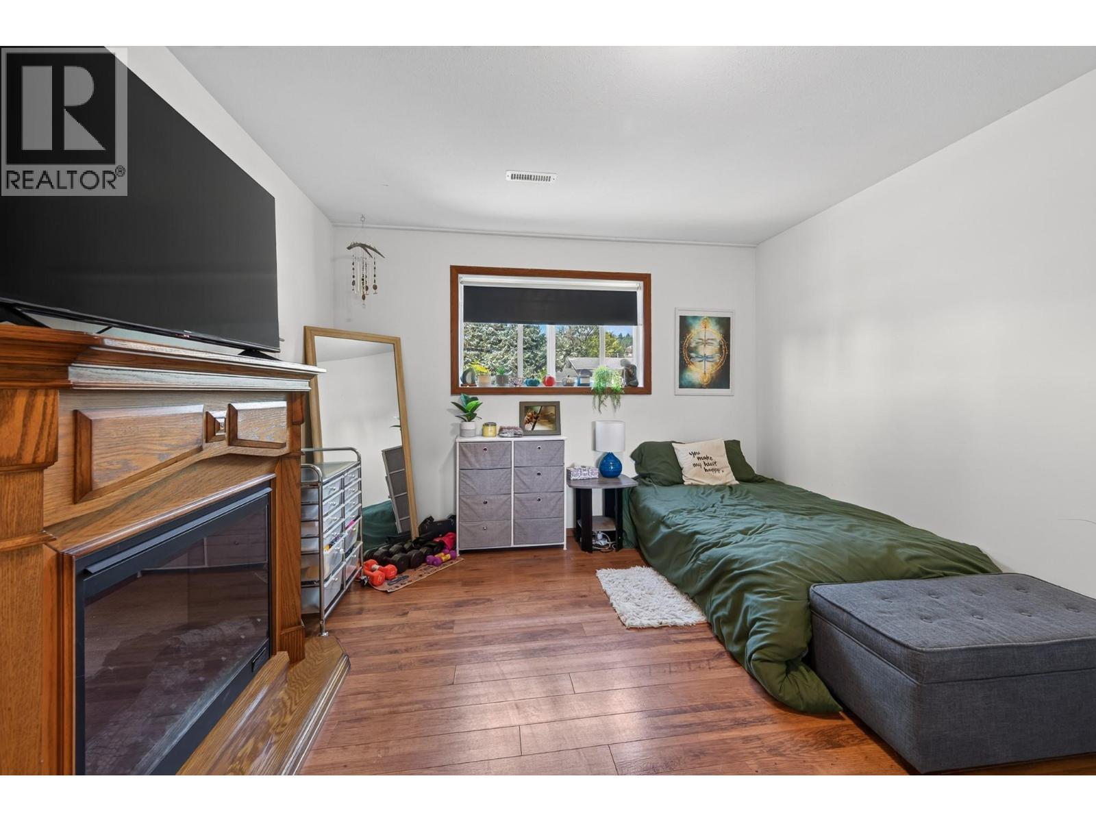6750 Heffley Road, Kamloops, BC - Indoor Photo Showing Bedroom With Fireplace