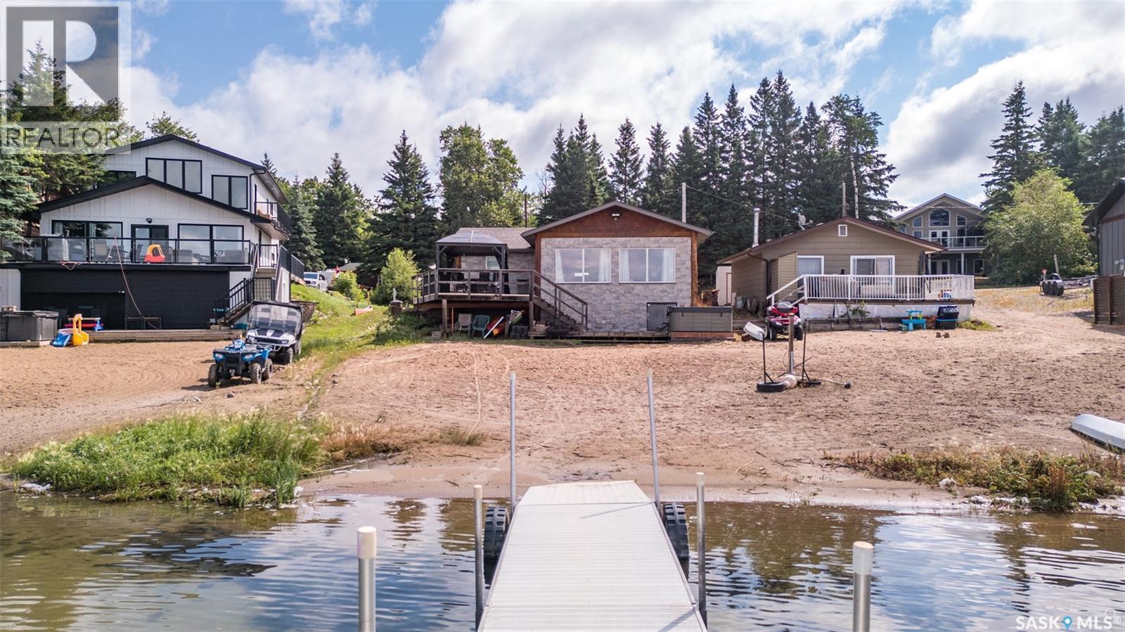 128 Jacobson Drive, Lakeland Rm No. 521, SK - Outdoor With Body Of Water With Deck Patio Veranda