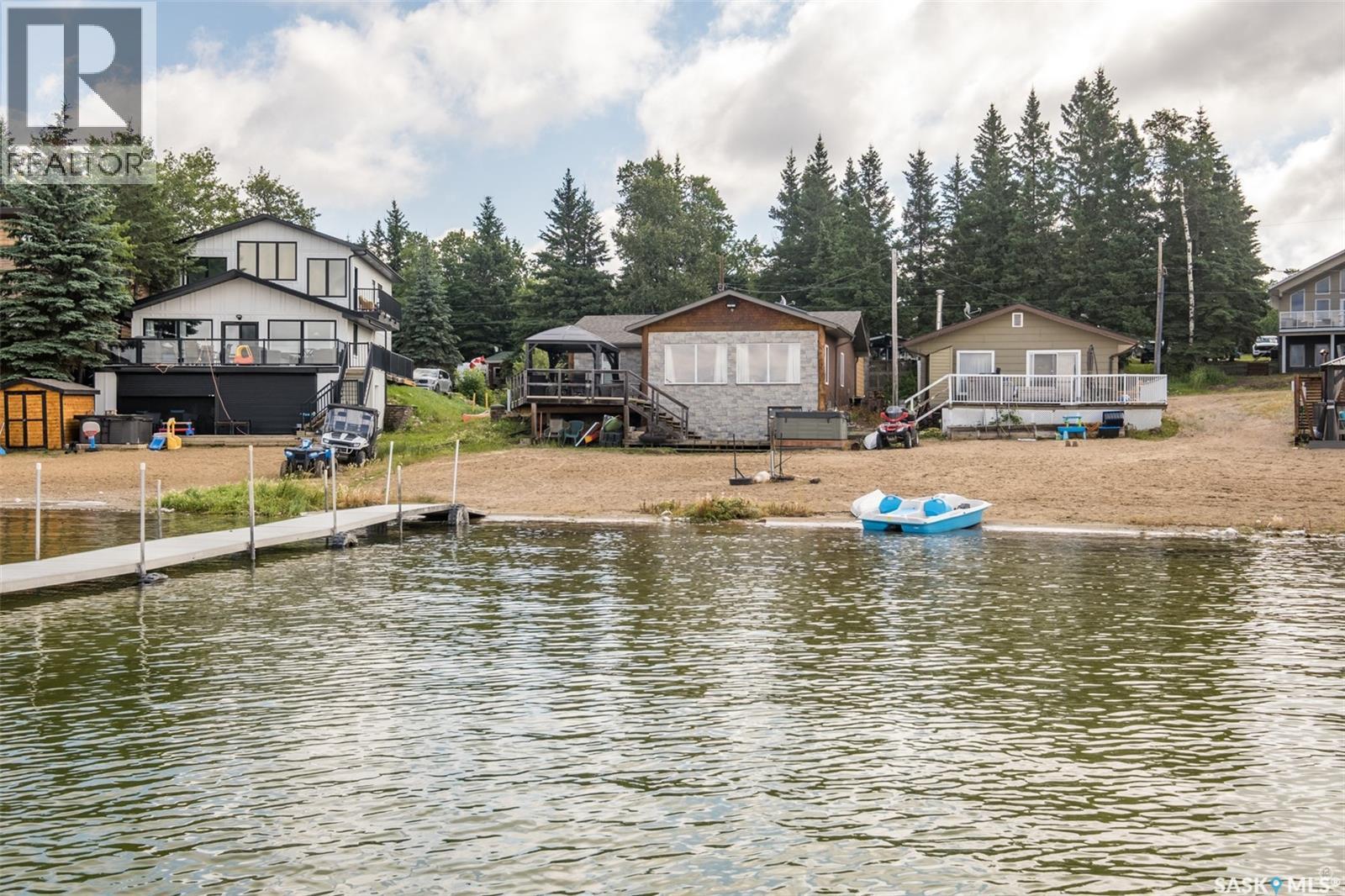 128 Jacobson Drive, Lakeland Rm No. 521, SK - Outdoor With Body Of Water With Deck Patio Veranda