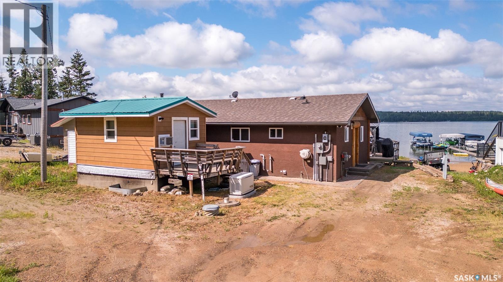 128 Jacobson Drive, Lakeland Rm No. 521, SK - Outdoor With Body Of Water With Deck Patio Veranda