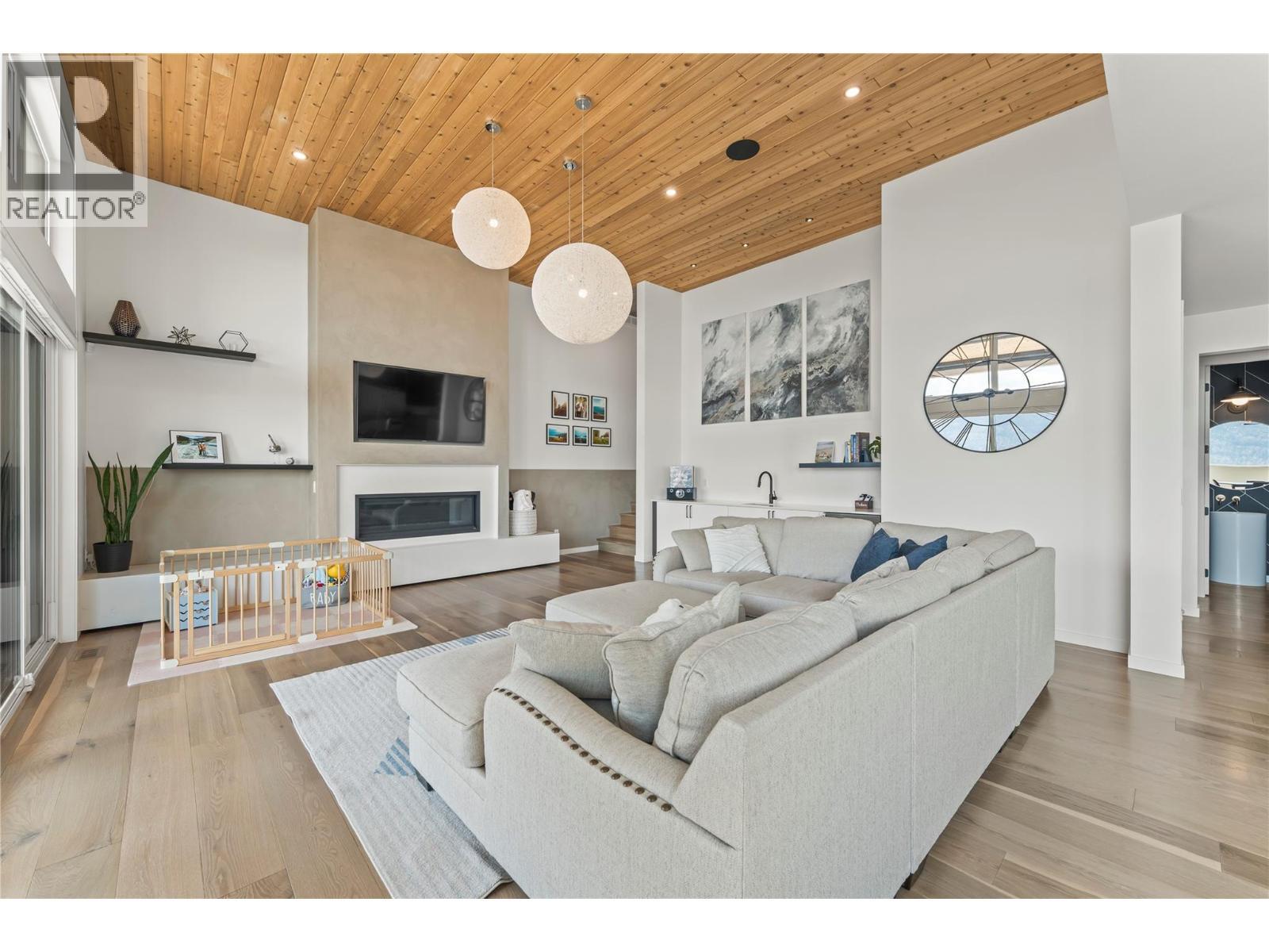 9815 Beacon Hill Crescent, Lake Country, BC - Indoor Photo Showing Living Room With Fireplace