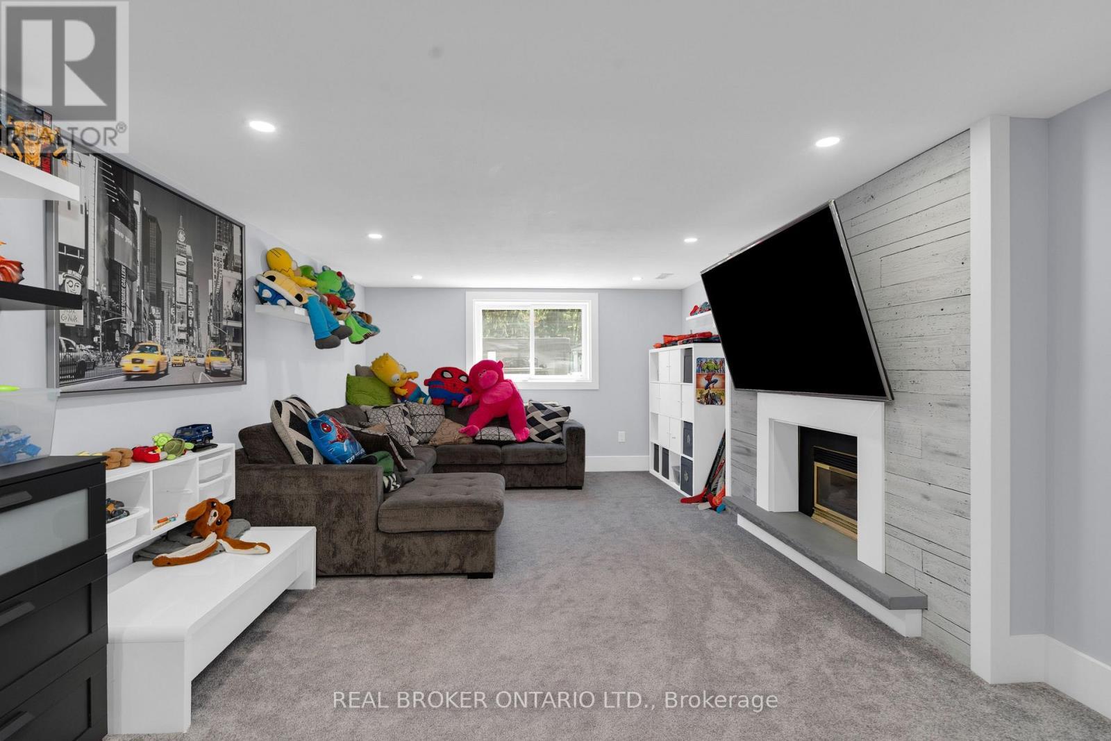 975 Sunnidale Road, Springwater, ON - Indoor Photo Showing Living Room With Fireplace