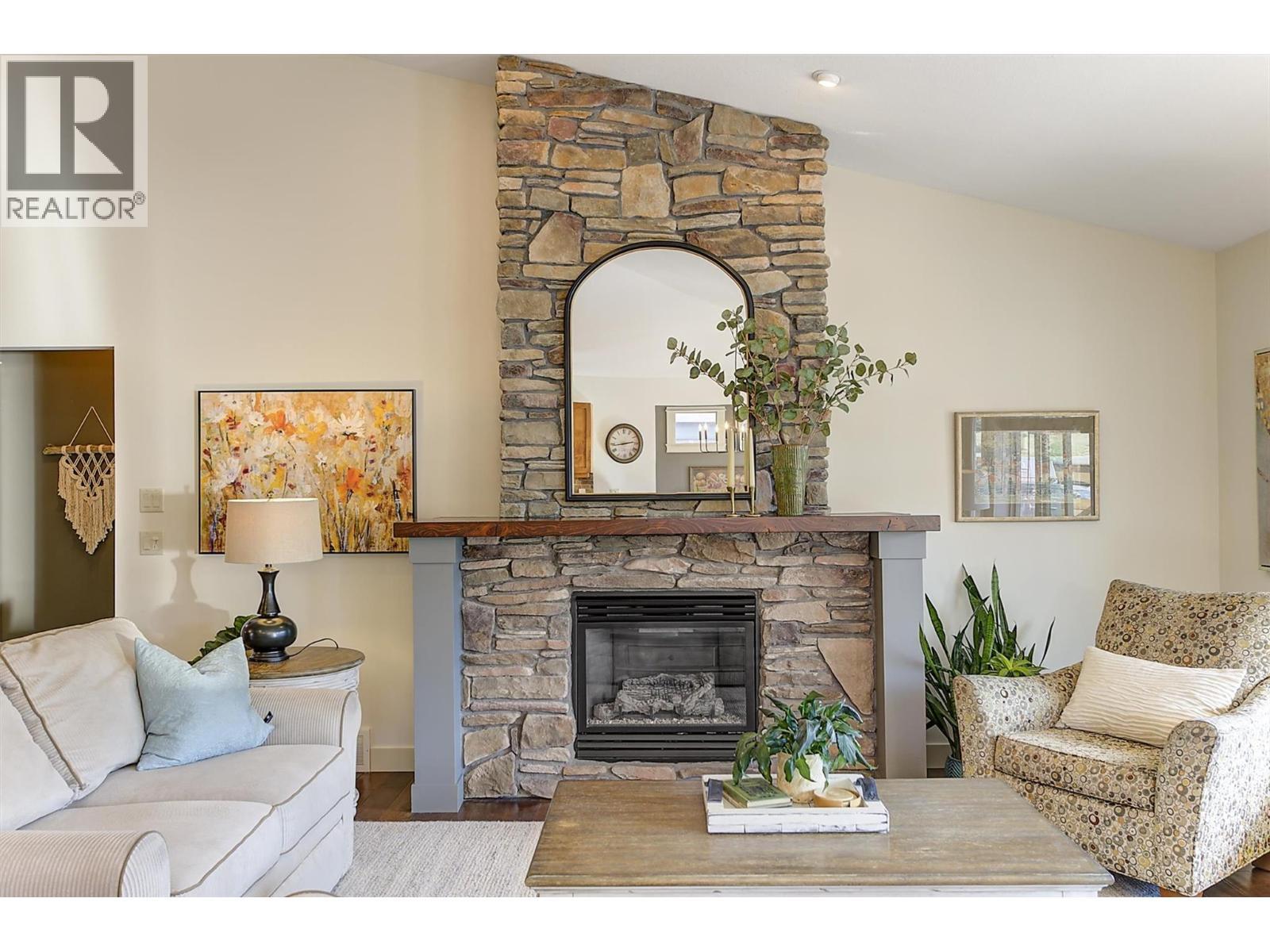 12931 East Ridge Drive, Lake Country, BC - Indoor Photo Showing Living Room With Fireplace