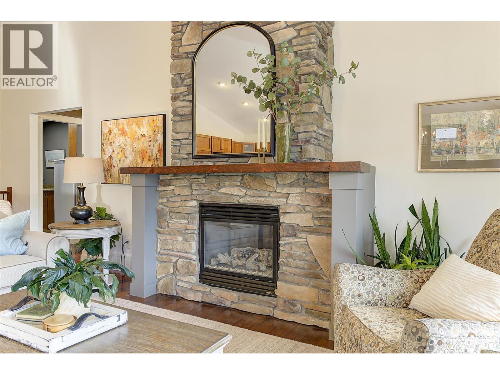 12931 East Ridge Drive, Lake Country, BC - Indoor Photo Showing Living Room With Fireplace